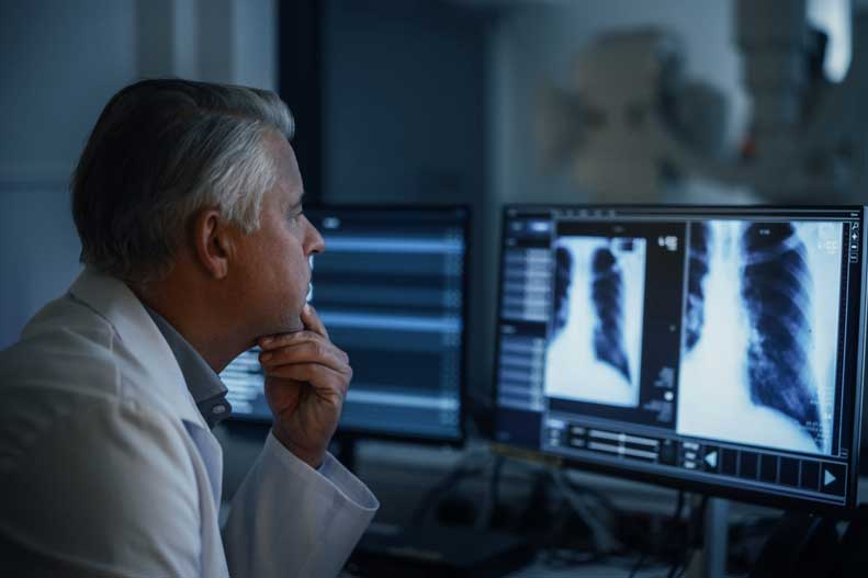 radiologist reviews medical images