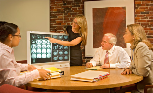 stroke lawyers reviewing brain imaging