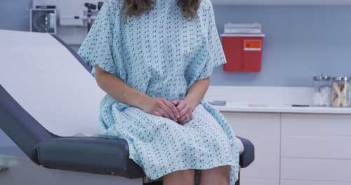 Woman on exam table at doctor's office