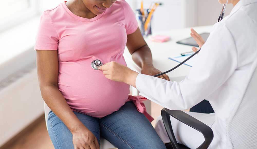 African-American woman at pregnancy obstetrical checkup